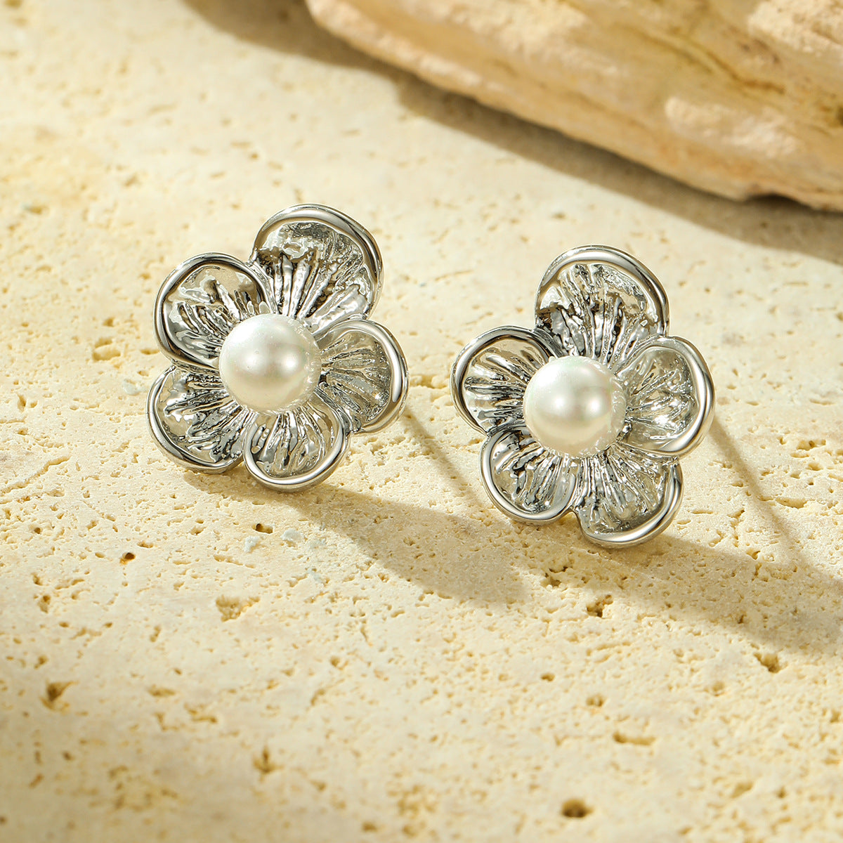 Cross-border new all-match high-grade titanium steel flower inlaid pearl earrings European and American exaggerated trend earrings