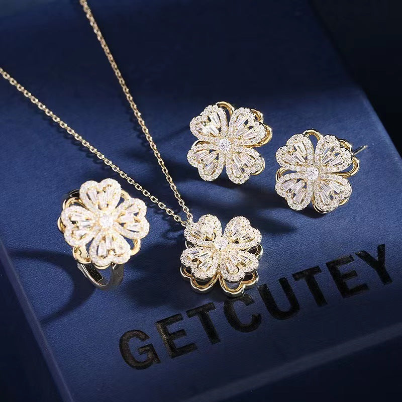 Internet celebrity's same style Shilairun rotatable four-leaf clover pendant 925 silver needle earrings ring rotating necklace set