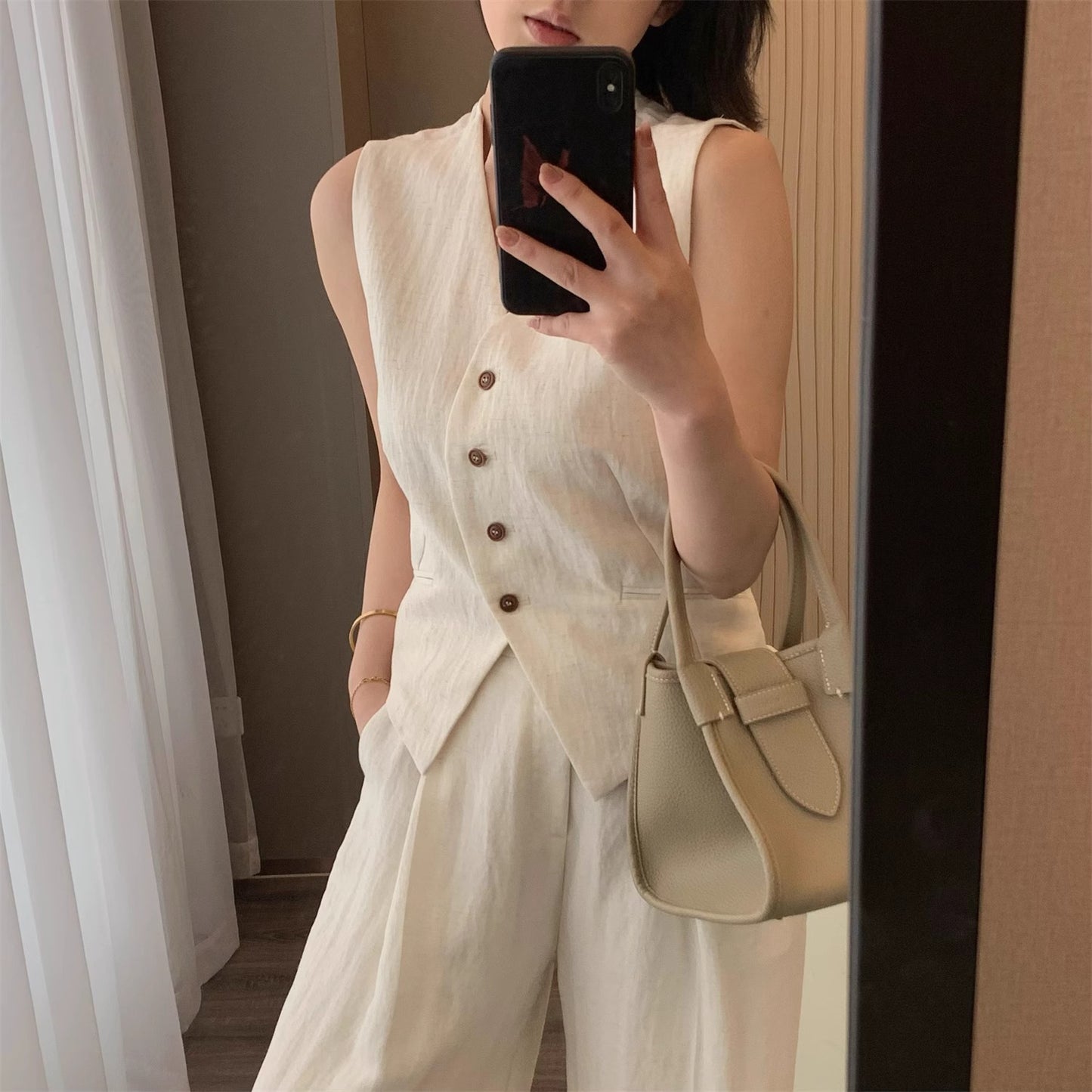 Tencel linen sleeveless high-end two-piece set for summer 2026, featuring a classic style with a vest and wide-leg pants.