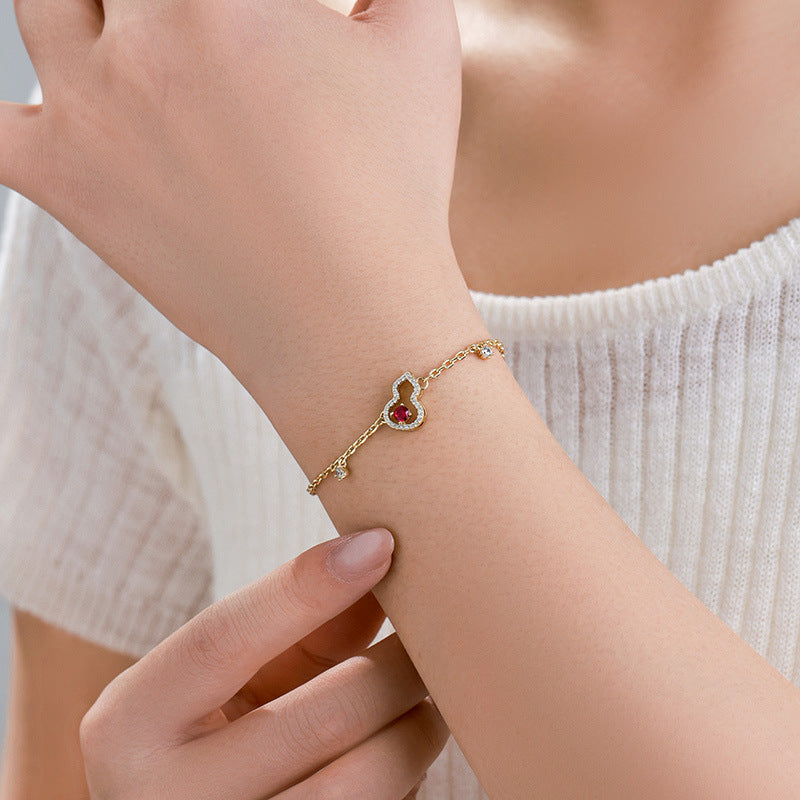 Xuping's New Fashionable Alloy Electroplated 14k Color Artificial Gemstone Hollow Gourd Bracelet, A Niche and Elegant Jewelry