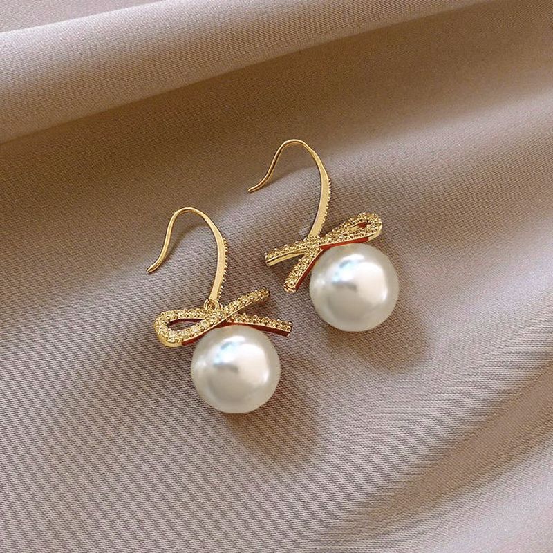 High-end imitation Baroque imitation pearl earrings niche light luxury bow diamond earrings 2025 new popular earrings