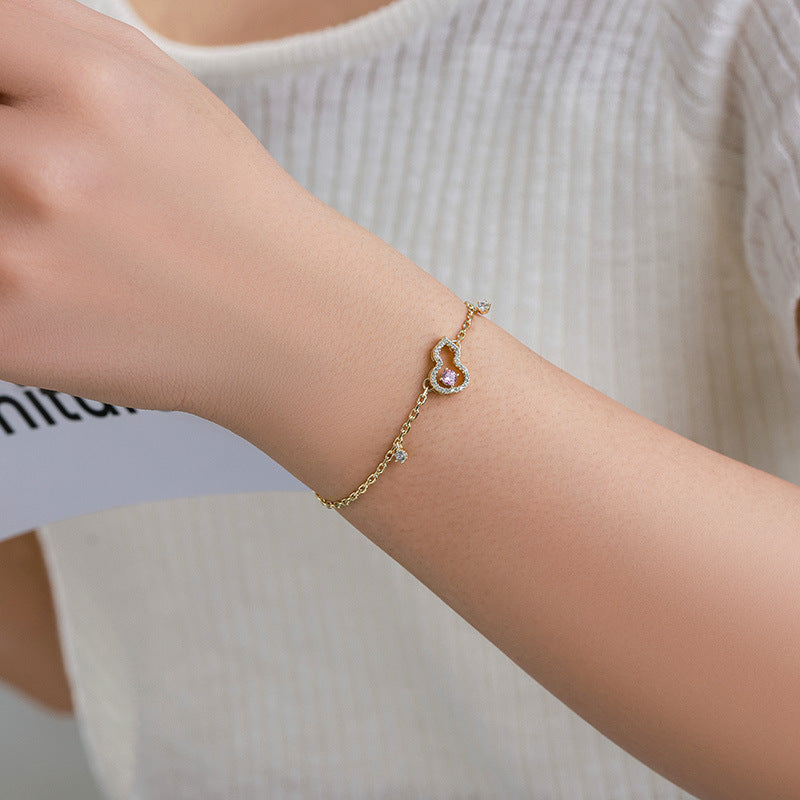 Xuping's New Fashionable Alloy Electroplated 14k Color Artificial Gemstone Hollow Gourd Bracelet, A Niche and Elegant Jewelry