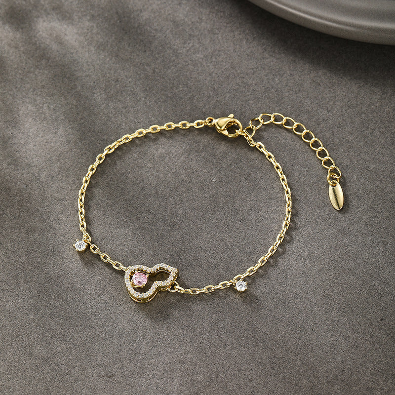 Xuping's New Fashionable Alloy Electroplated 14k Color Artificial Gemstone Hollow Gourd Bracelet, A Niche and Elegant Jewelry